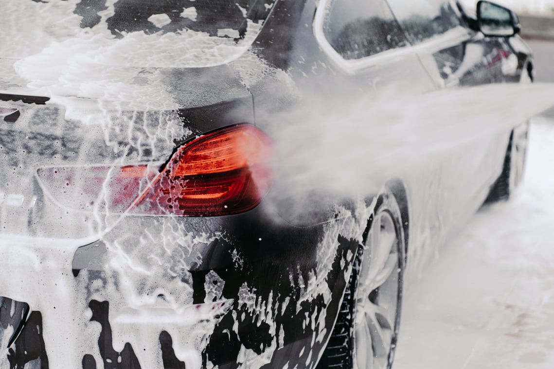 Car Cleaning Auto Service. High Pressure Water. Detail on Water Jet. Washing in Carwash or Cleaner Station. Close up with Selective Focus.